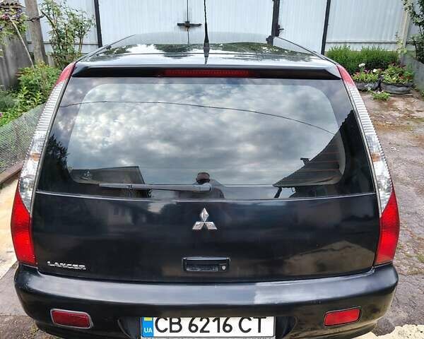 Черный Мицубиси Лансер, объемом двигателя 1.6 л и пробегом 280 тыс. км за 4500 $, фото 4 на Automoto.ua
