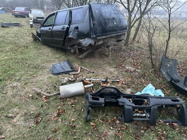 Черный Мицубиси Лансер, объемом двигателя 0 л и пробегом 300 тыс. км за 12000 $, фото 7 на Automoto.ua