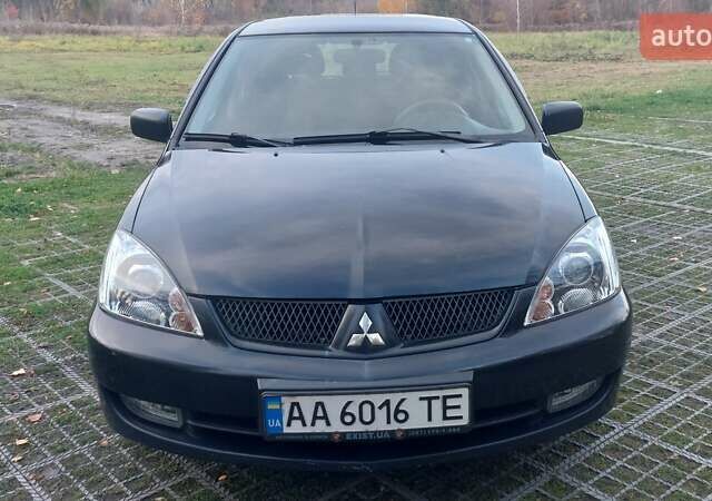 Мицубиси Лансер 2006 в Киеве на Automoto.ua Черный Мицубиси Лансер, объемом двигателя 1.58 л и пробегом 296 тыс. км за 4500 $, фото 13 на Automoto.ua