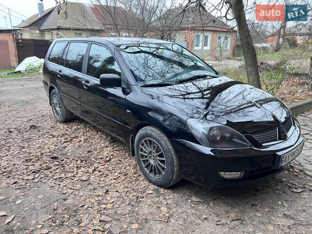 Чорний Міцубісі Lancer, об'ємом двигуна 1.6 л та пробігом 220 тис. км за 5500 $, фото 1 на Automoto.ua