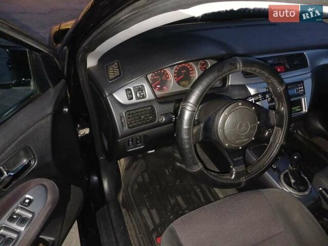 Чорний Міцубісі Lancer, об'ємом двигуна 0 л та пробігом 334 тис. км за 4300 $, фото 4 на Automoto.ua