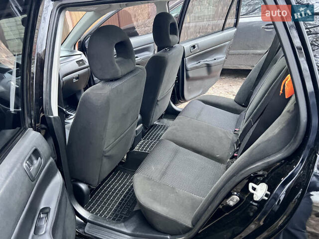Чорний Міцубісі Lancer, об'ємом двигуна 1.6 л та пробігом 220 тис. км за 5500 $, фото 10 на Automoto.ua