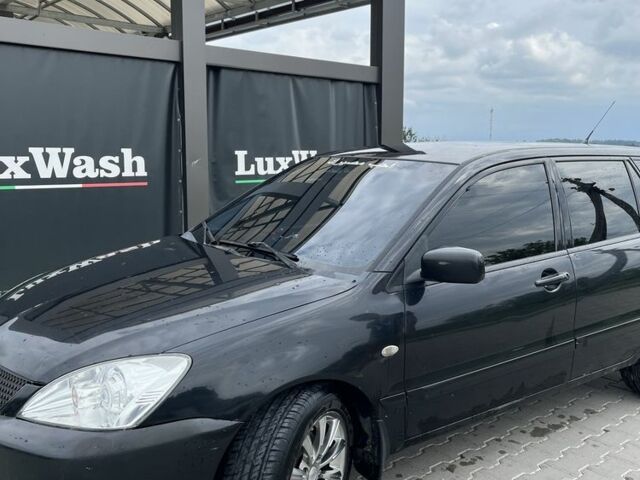 Чорний Міцубісі Lancer, об'ємом двигуна 1.6 л та пробігом 340 тис. км за 3500 $, фото 14 на Automoto.ua