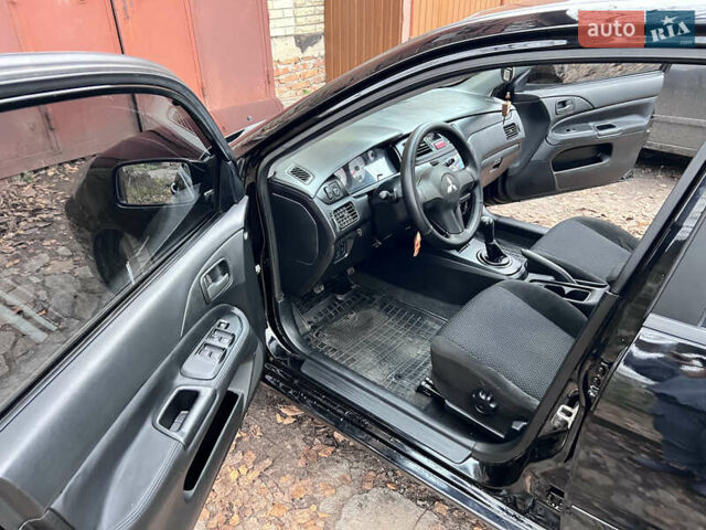 Чорний Міцубісі Lancer, об'ємом двигуна 1.6 л та пробігом 220 тис. км за 5500 $, фото 9 на Automoto.ua