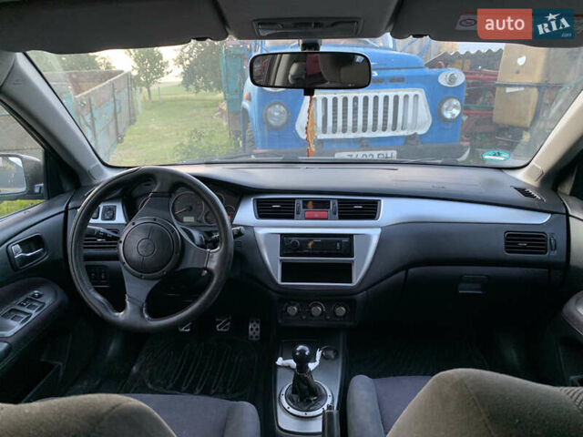 Черный Мицубиси Лансер, объемом двигателя 2 л и пробегом 212 тыс. км за 4500 $, фото 5 на Automoto.ua