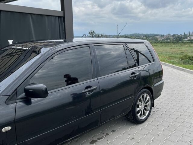 Чорний Міцубісі Lancer, об'ємом двигуна 1.6 л та пробігом 340 тис. км за 3500 $, фото 12 на Automoto.ua