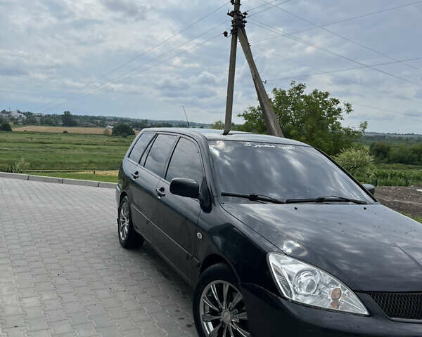 Черный Мицубиси Лансер, объемом двигателя 1.6 л и пробегом 340 тыс. км за 3499 $, фото 3 на Automoto.ua