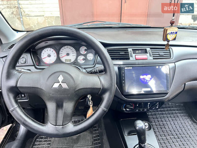 Чорний Міцубісі Lancer, об'ємом двигуна 1.6 л та пробігом 220 тис. км за 5500 $, фото 7 на Automoto.ua