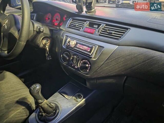 Чорний Міцубісі Lancer, об'ємом двигуна 1.6 л та пробігом 180 тис. км за 4100 $, фото 12 на Automoto.ua