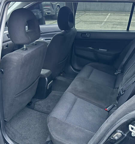 Чорний Міцубісі Lancer, об'ємом двигуна 1.58 л та пробігом 260 тис. км за 3299 $, фото 17 на Automoto.ua