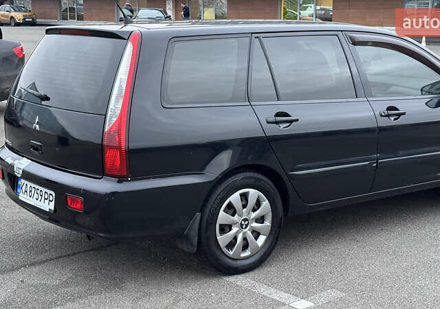 Чорний Міцубісі Lancer, об'ємом двигуна 1.58 л та пробігом 260 тис. км за 3299 $, фото 6 на Automoto.ua