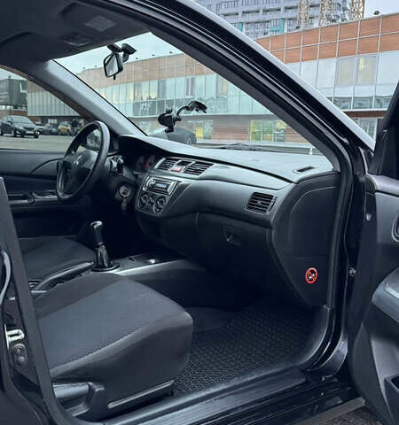Чорний Міцубісі Lancer, об'ємом двигуна 1.58 л та пробігом 260 тис. км за 3299 $, фото 29 на Automoto.ua