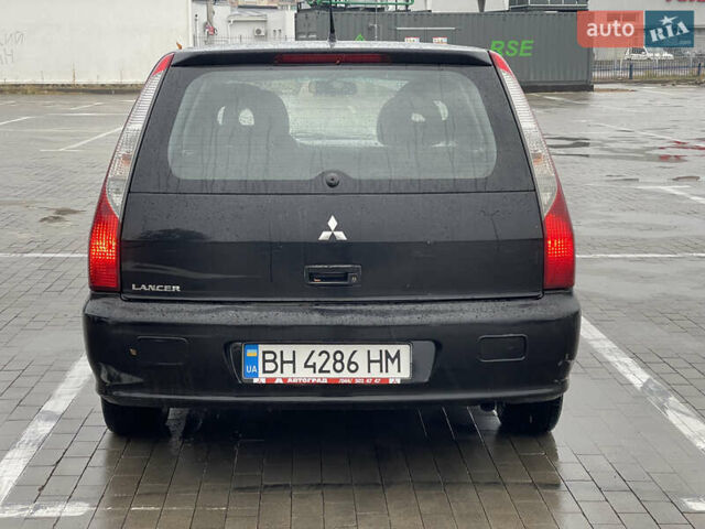 Черный Мицубиси Лансер, объемом двигателя 1.6 л и пробегом 200 тыс. км за 3900 $, фото 2 на Automoto.ua