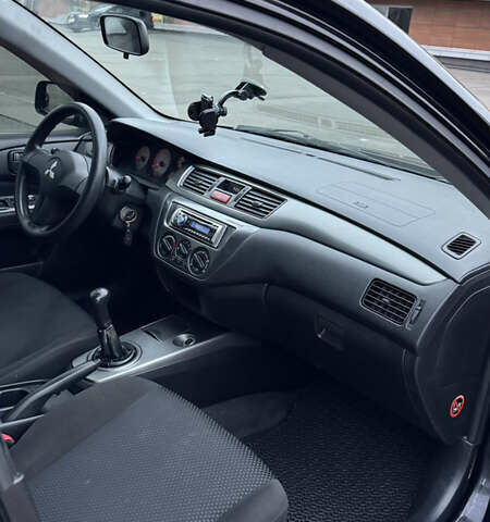 Чорний Міцубісі Lancer, об'ємом двигуна 1.58 л та пробігом 260 тис. км за 3299 $, фото 31 на Automoto.ua
