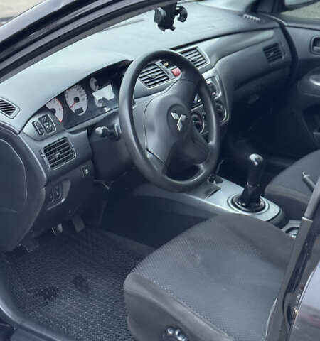 Чорний Міцубісі Lancer, об'ємом двигуна 1.58 л та пробігом 260 тис. км за 3299 $, фото 10 на Automoto.ua