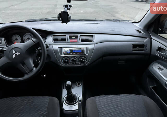 Чорний Міцубісі Lancer, об'ємом двигуна 1.58 л та пробігом 260 тис. км за 3299 $, фото 20 на Automoto.ua