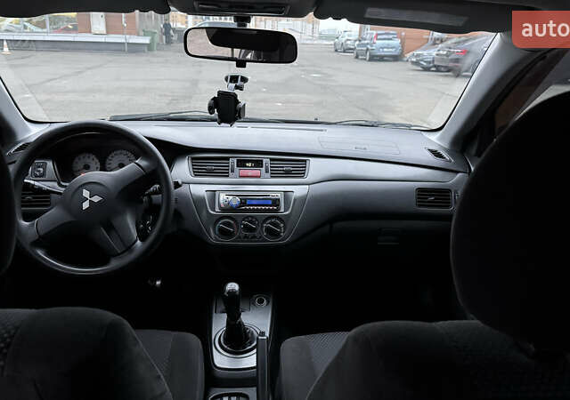Чорний Міцубісі Lancer, об'ємом двигуна 1.58 л та пробігом 260 тис. км за 3299 $, фото 19 на Automoto.ua