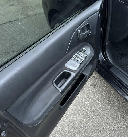 Чорний Міцубісі Lancer, об'ємом двигуна 1.58 л та пробігом 260 тис. км за 3299 $, фото 12 на Automoto.ua