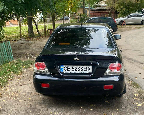 Чорний Міцубісі Lancer, об'ємом двигуна 1.58 л та пробігом 240 тис. км за 4000 $, фото 2 на Automoto.ua