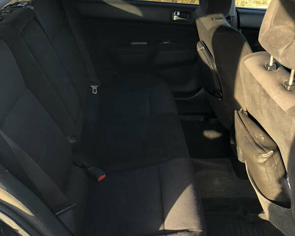 Чорний Міцубісі Lancer, об'ємом двигуна 1.58 л та пробігом 206 тис. км за 2900 $, фото 7 на Automoto.ua