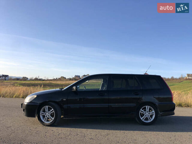Чорний Міцубісі Lancer, об'ємом двигуна 1.58 л та пробігом 206 тис. км за 2900 $, фото 1 на Automoto.ua