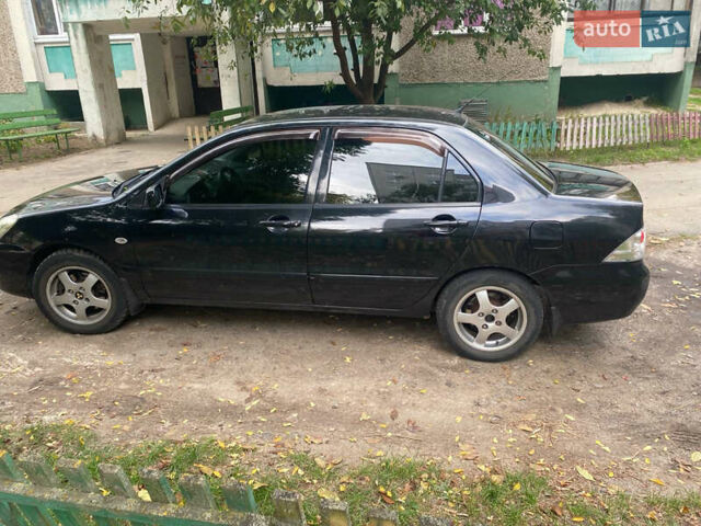 Чорний Міцубісі Lancer, об'ємом двигуна 1.58 л та пробігом 240 тис. км за 4000 $, фото 1 на Automoto.ua