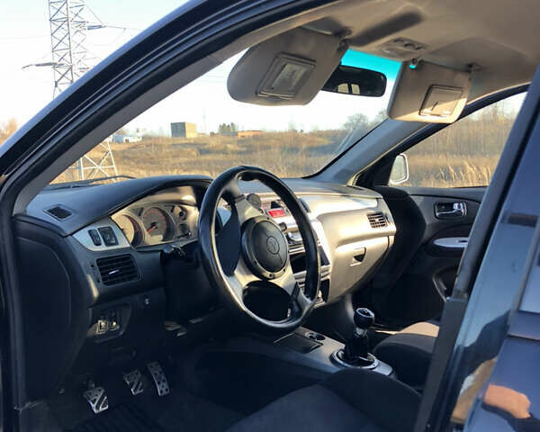Чорний Міцубісі Lancer, об'ємом двигуна 1.58 л та пробігом 206 тис. км за 2900 $, фото 4 на Automoto.ua