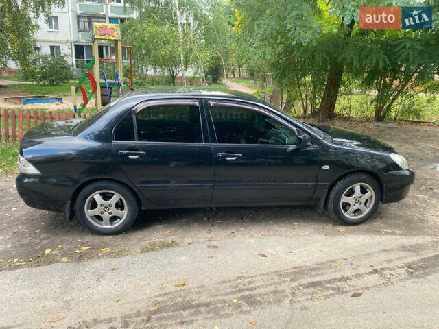 Чорний Міцубісі Lancer, об'ємом двигуна 1.58 л та пробігом 240 тис. км за 4000 $, фото 3 на Automoto.ua