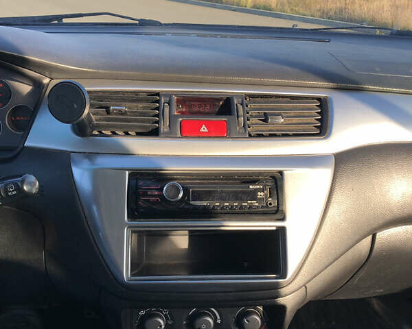 Чорний Міцубісі Lancer, об'ємом двигуна 1.58 л та пробігом 206 тис. км за 2900 $, фото 2 на Automoto.ua