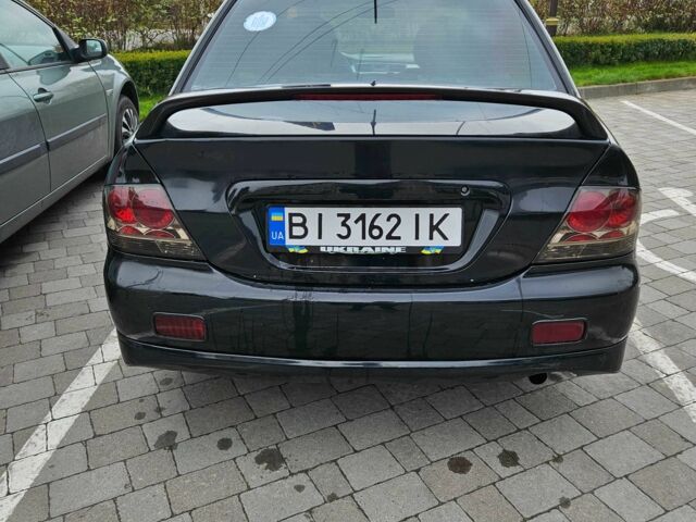 Міцубісі Lancer 2007 у Горішні Плавні (Комсомольськ) на Automoto.ua Чорний Міцубісі Lancer, об'ємом двигуна 2 л та пробігом 237 тис. км за 4300 $, фото 3 на Automoto.ua