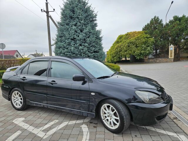 Міцубісі Lancer 2007 у Горішні Плавні (Комсомольськ) на Automoto.ua Чорний Міцубісі Lancer, об'ємом двигуна 2 л та пробігом 237 тис. км за 4300 $, фото 1 на Automoto.ua