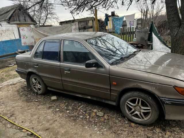 Коричневий Міцубісі Lancer, об'ємом двигуна 1.8 л та пробігом 200 тис. км за 1136 $, фото 1 на Automoto.ua
