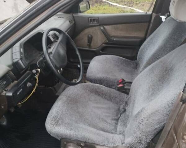 Коричневий Міцубісі Lancer, об'ємом двигуна 1.5 л та пробігом 200 тис. км за 700 $, фото 5 на Automoto.ua