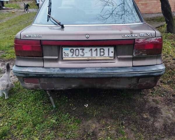 Коричневий Міцубісі Lancer, об'ємом двигуна 1.5 л та пробігом 200 тис. км за 700 $, фото 8 на Automoto.ua