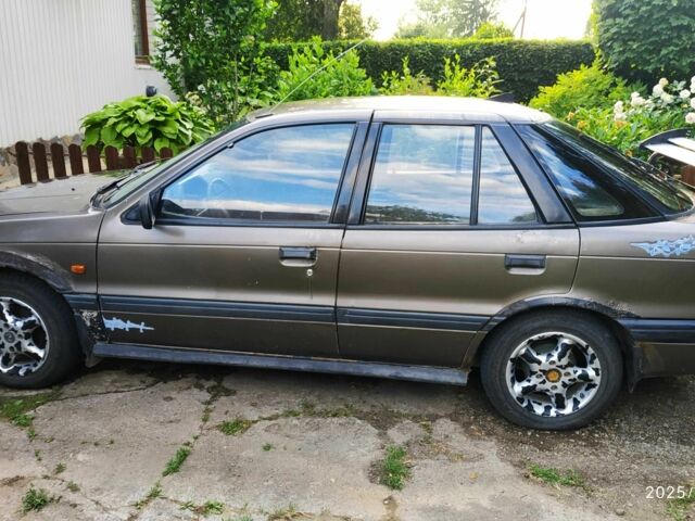 Коричневий Міцубісі Lancer, об'ємом двигуна 1.5 л та пробігом 608 тис. км за 900 $, фото 1 на Automoto.ua