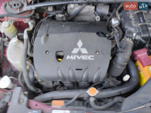 Червоний Міцубісі Lancer, об'ємом двигуна 2 л та пробігом 168 тис. км за 6800 $, фото 2 на Automoto.ua