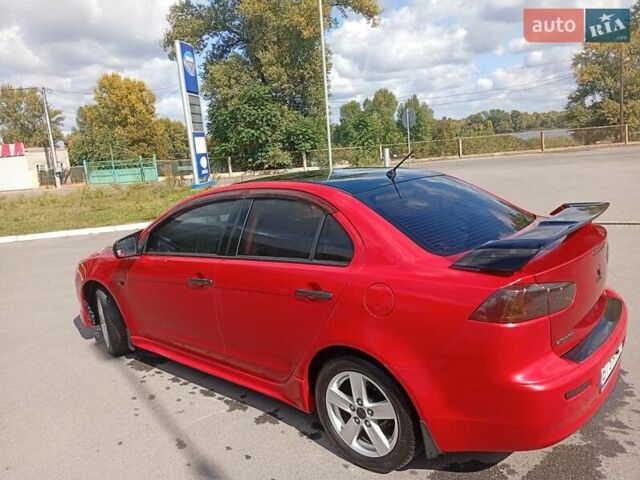 Червоний Міцубісі Lancer, об'ємом двигуна 2 л та пробігом 168 тис. км за 6800 $, фото 13 на Automoto.ua