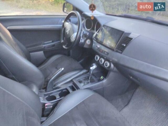 Червоний Міцубісі Lancer, об'ємом двигуна 2 л та пробігом 168 тис. км за 6800 $, фото 5 на Automoto.ua