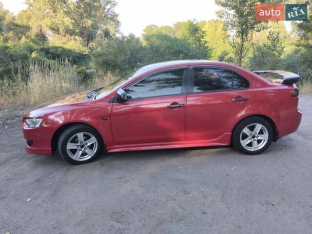 Червоний Міцубісі Lancer, об'ємом двигуна 2 л та пробігом 168 тис. км за 6800 $, фото 3 на Automoto.ua
