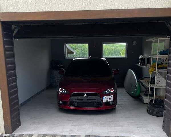 Красный Мицубиси Лансер, объемом двигателя 2 л и пробегом 128 тыс. км за 14700 $, фото 13 на Automoto.ua