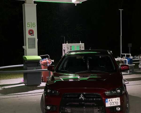 Красный Мицубиси Лансер, объемом двигателя 2 л и пробегом 128 тыс. км за 14700 $, фото 16 на Automoto.ua