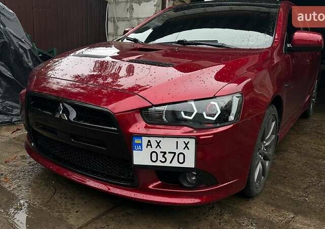 Красный Мицубиси Лансер, объемом двигателя 2 л и пробегом 128 тыс. км за 14700 $, фото 12 на Automoto.ua