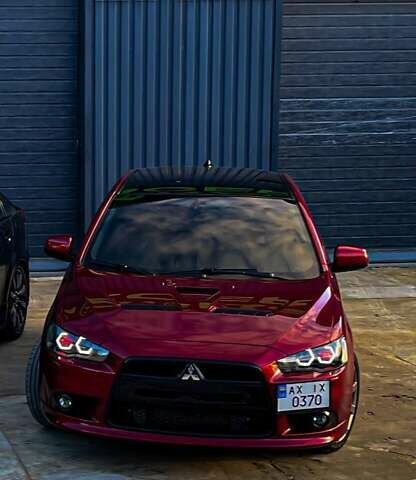 Красный Мицубиси Лансер, объемом двигателя 2 л и пробегом 128 тыс. км за 14700 $, фото 7 на Automoto.ua