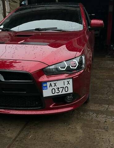 Красный Мицубиси Лансер, объемом двигателя 2 л и пробегом 128 тыс. км за 14700 $, фото 11 на Automoto.ua