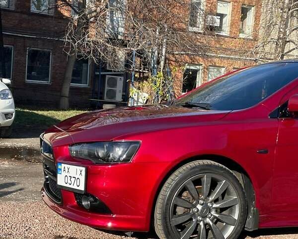 Красный Мицубиси Лансер, объемом двигателя 2 л и пробегом 128 тыс. км за 14700 $, фото 8 на Automoto.ua