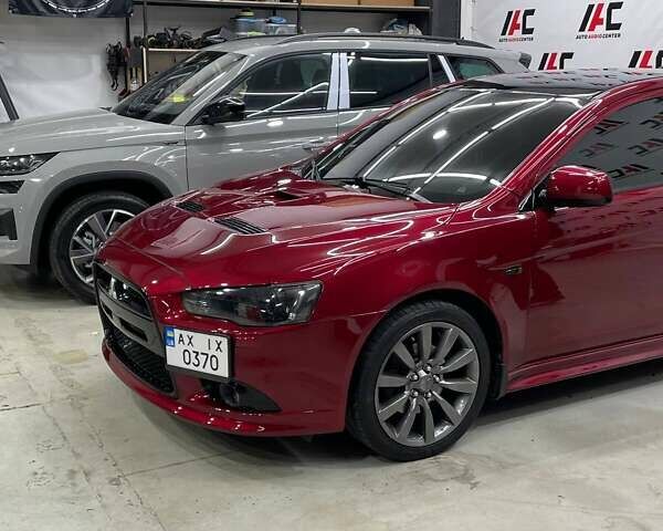 Красный Мицубиси Лансер, объемом двигателя 2 л и пробегом 128 тыс. км за 14700 $, фото 4 на Automoto.ua