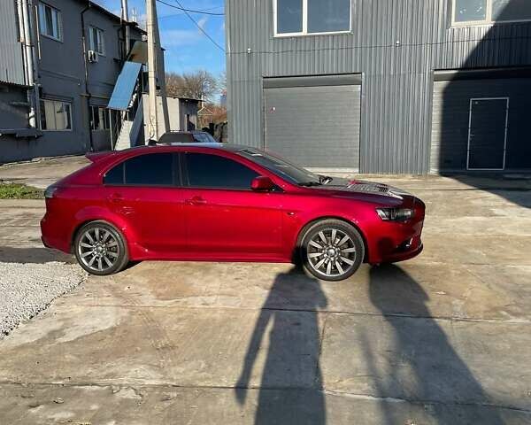 Красный Мицубиси Лансер, объемом двигателя 2 л и пробегом 128 тыс. км за 14700 $, фото 10 на Automoto.ua