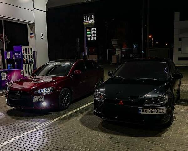 Красный Мицубиси Лансер, объемом двигателя 2 л и пробегом 128 тыс. км за 14700 $, фото 15 на Automoto.ua