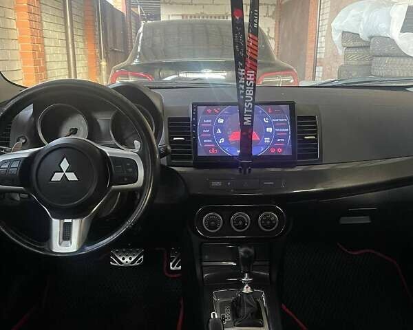 Красный Мицубиси Лансер, объемом двигателя 2 л и пробегом 128 тыс. км за 14700 $, фото 18 на Automoto.ua