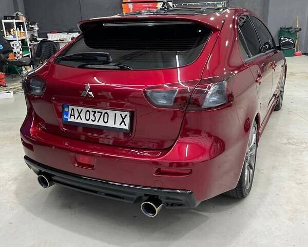 Красный Мицубиси Лансер, объемом двигателя 2 л и пробегом 128 тыс. км за 14700 $, фото 5 на Automoto.ua